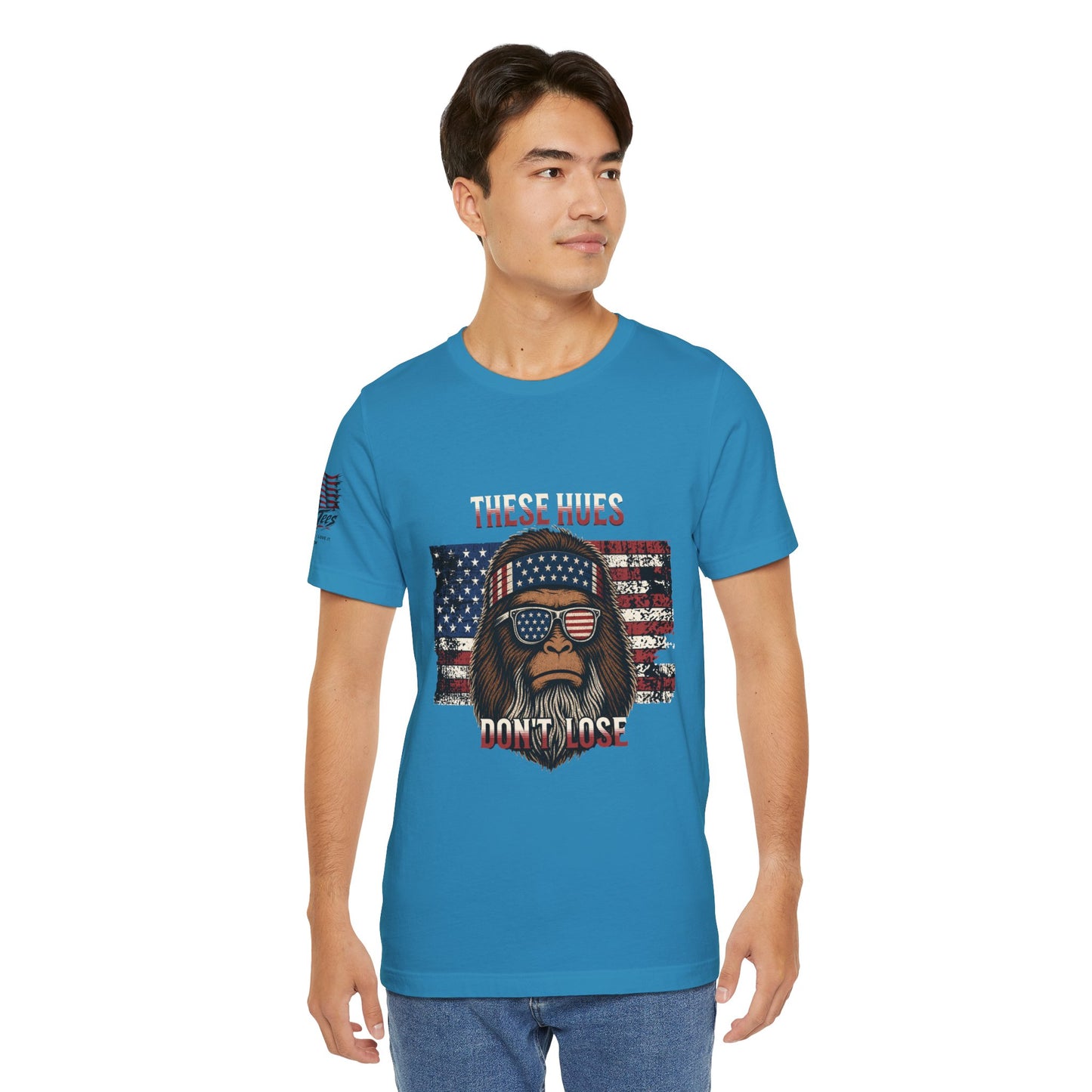 These Hues Don't Lose — Bigfoot American Flag Tee