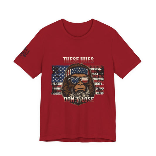 These Hues Don't Lose — Bigfoot American Flag Tee