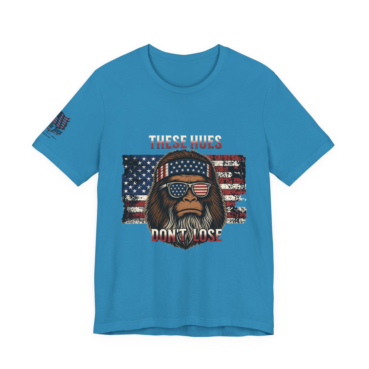 These Hues Don't Lose — Bigfoot American Flag Tee