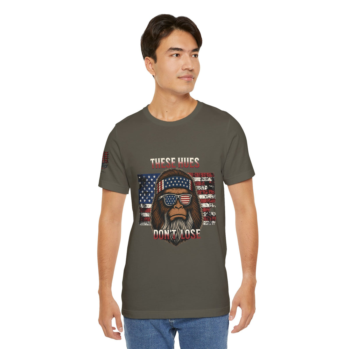 These Hues Don't Lose — Bigfoot American Flag Tee
